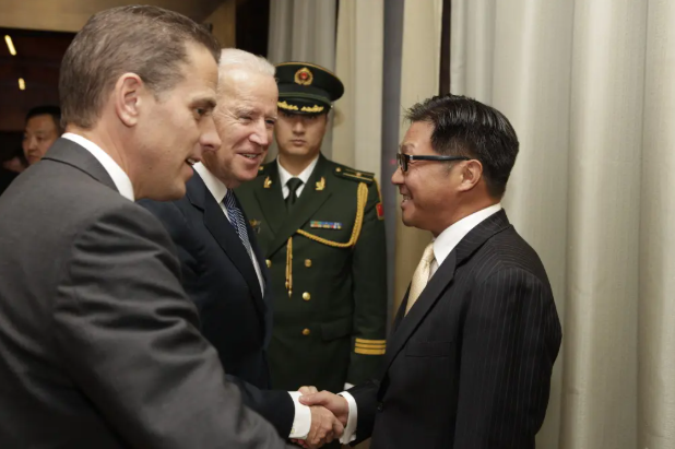 Joe Biden is pictured shaking hands with BHR Partners CEO Jonathan Li