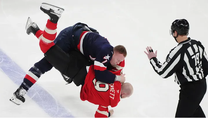 Brady Tkachuk (top) of the U.S. fights Canada's Sam Bennett (9) during the first period of 4 Nations Face-Off hockey action in Montreal Saturday, Feb. 15, 2025.